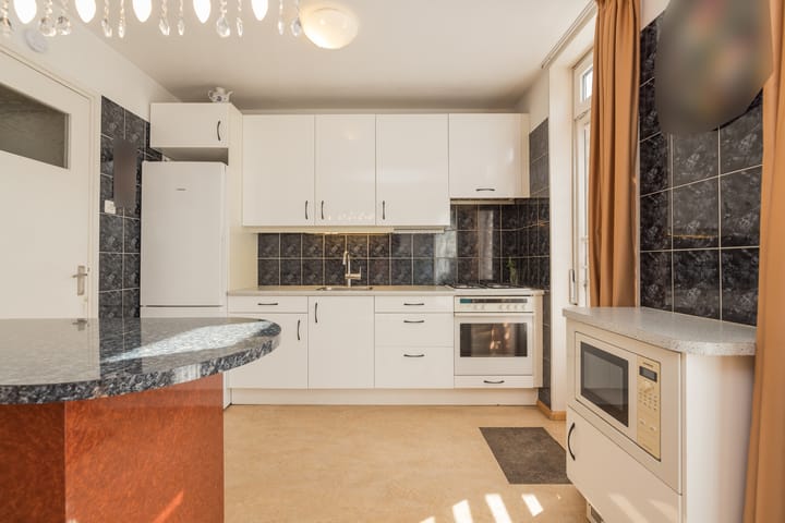 Foto 16 van van den Woudestraat 20