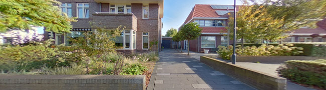 View 360° photo of Straat en vooraanzicht of Robert Johnsonstraat 41