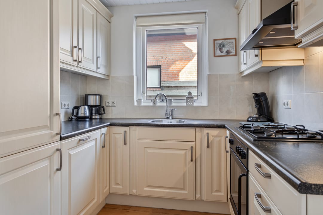 Foto 11 van Tienwoningenweg 23