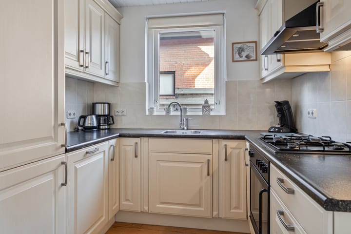 Foto 11 van Tienwoningenweg 23