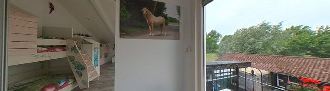 Slaapkamer met balkon