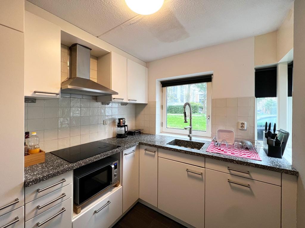 Foto 13 van Makelaar 25