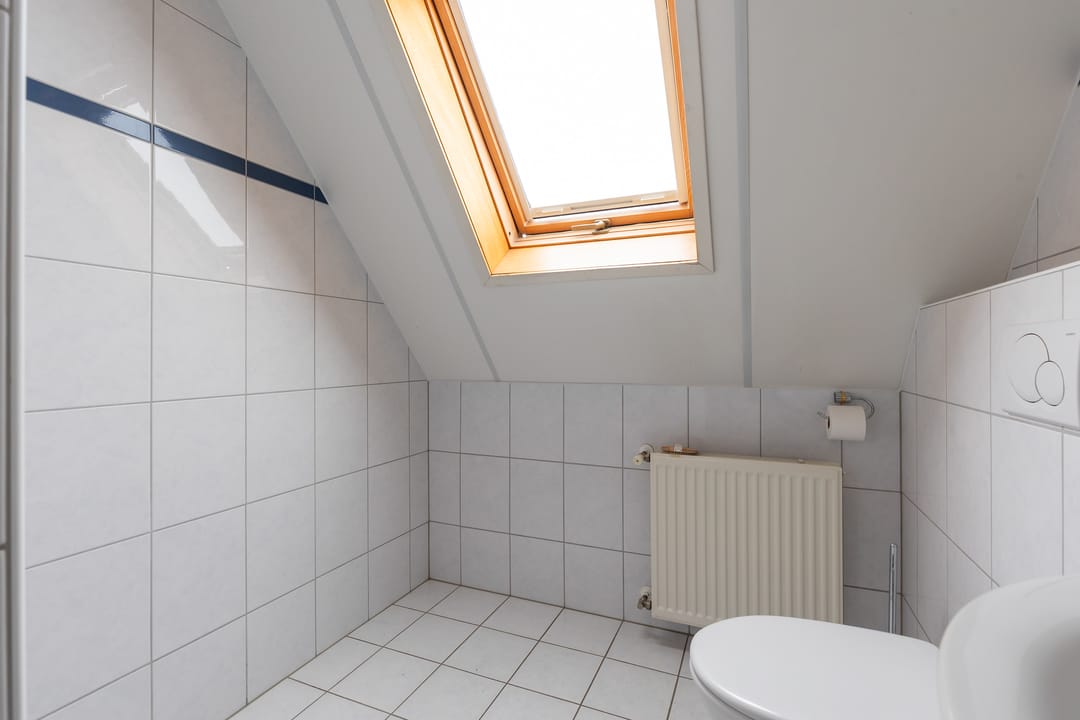 Foto 26 van Tienwoningenweg 9