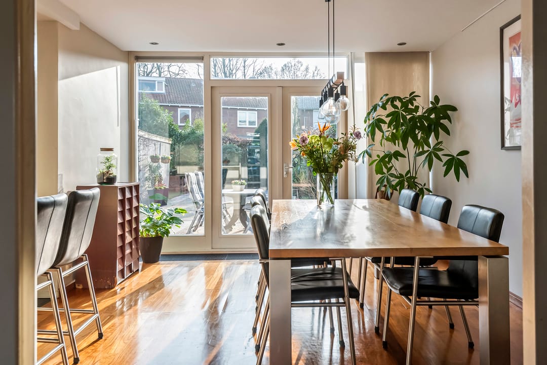 Spacious semi-detached home with character, featuring 5 bedrooms, suite-style living room, and sunny southwest garden — 15