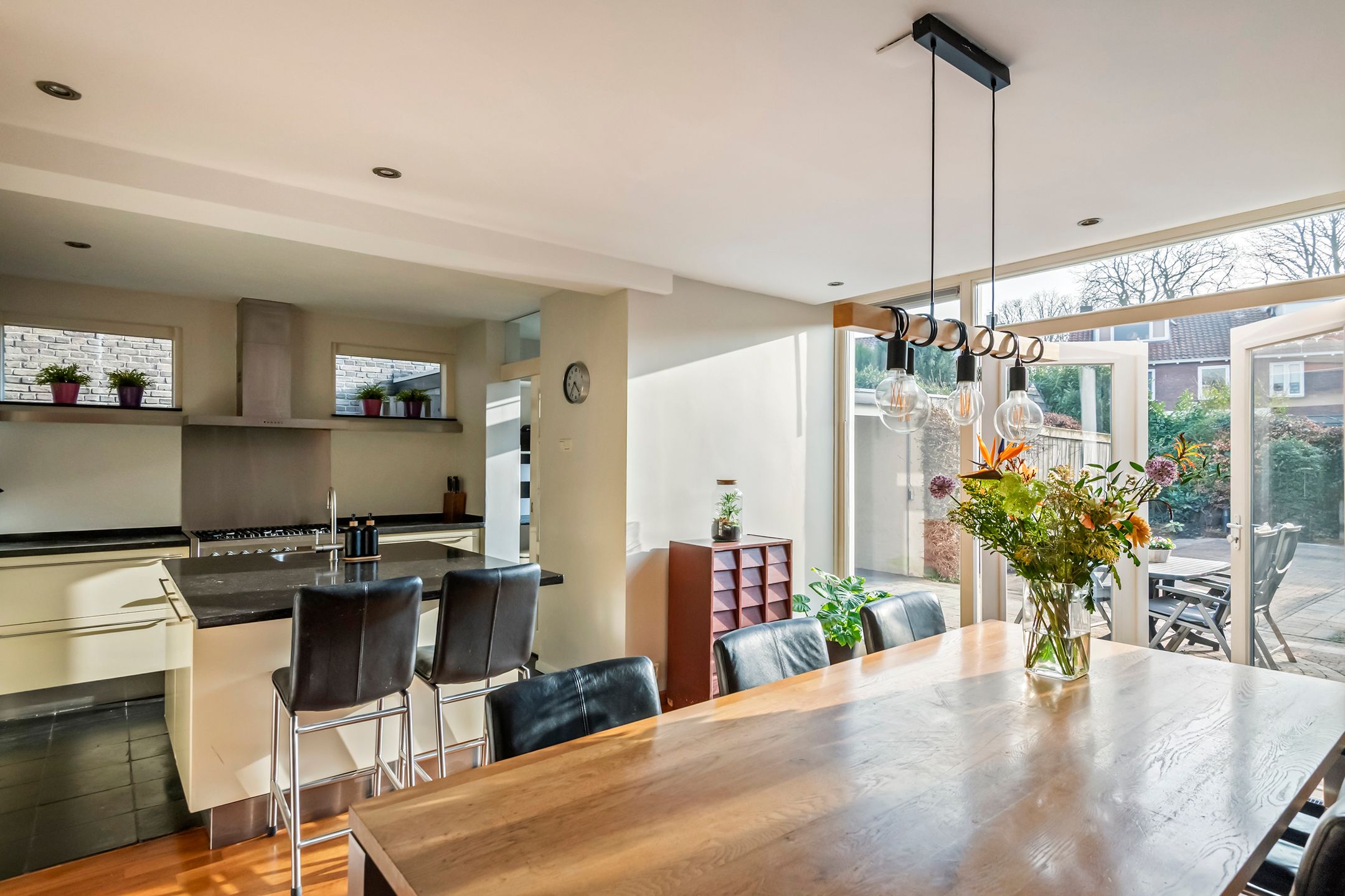 Spacious semi-detached home with character, featuring 5 bedrooms, suite-style living room, and sunny southwest garden — 19