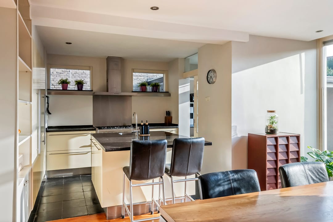 Spacious semi-detached home with character, featuring 5 bedrooms, suite-style living room, and sunny southwest garden — 20