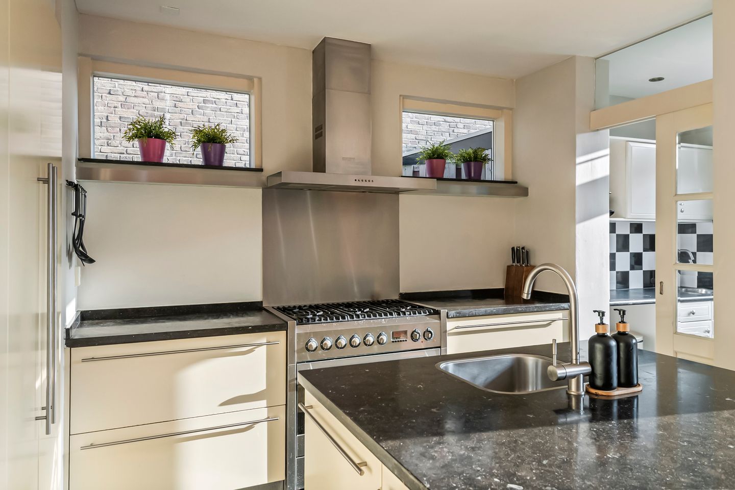 Spacious semi-detached home with character, featuring 5 bedrooms, suite-style living room, and sunny southwest garden — 23