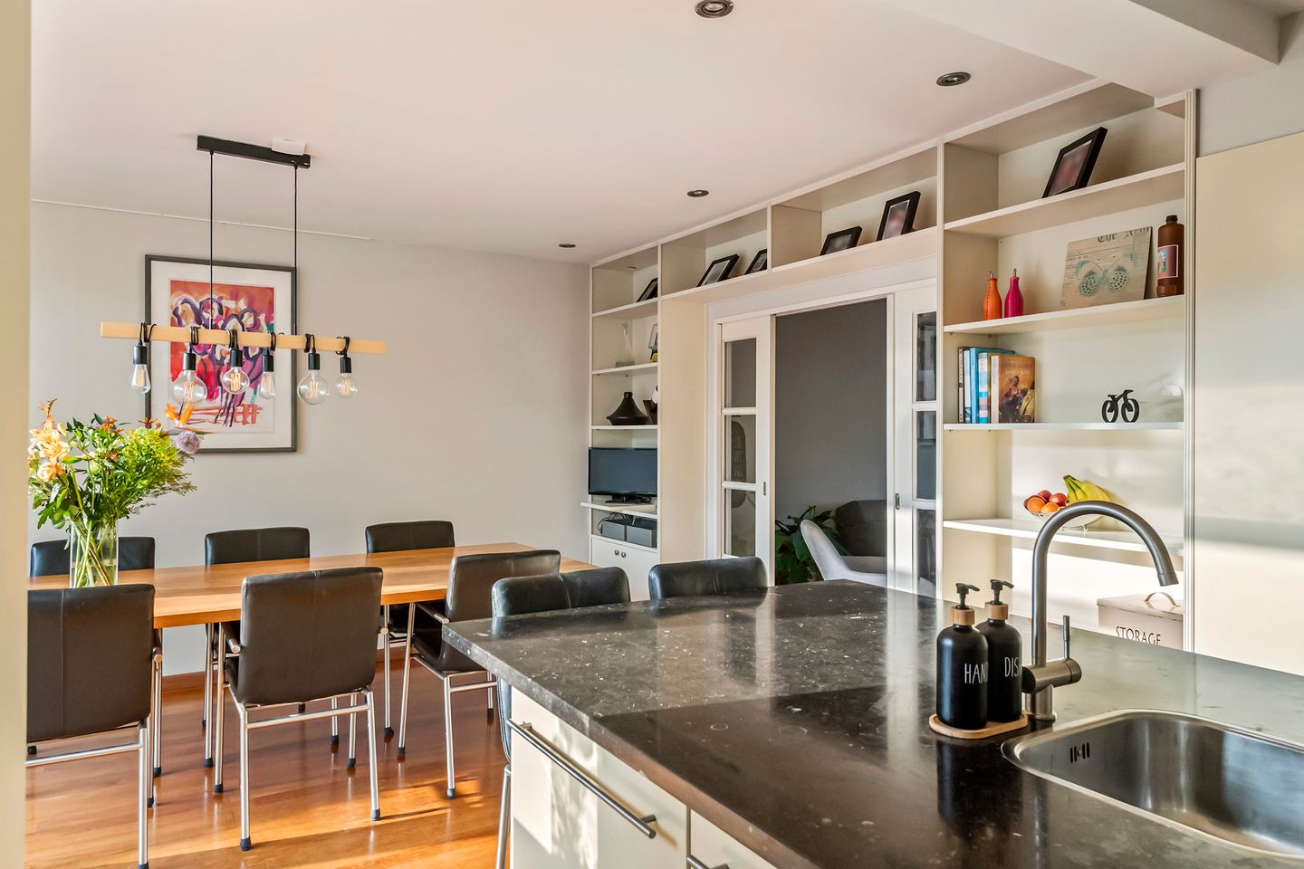 Spacious semi-detached home with character, featuring 5 bedrooms, suite-style living room, and sunny southwest garden — 26