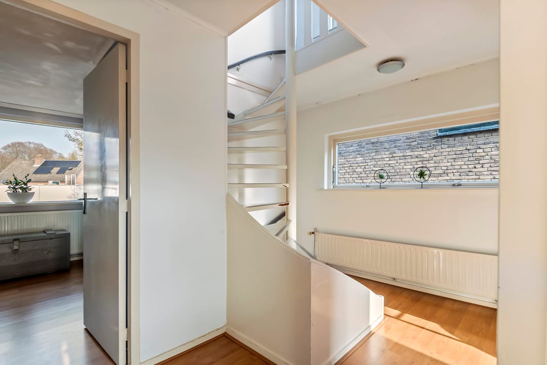 Spacious semi-detached home with character, featuring 5 bedrooms, suite-style living room, and sunny southwest garden — 29