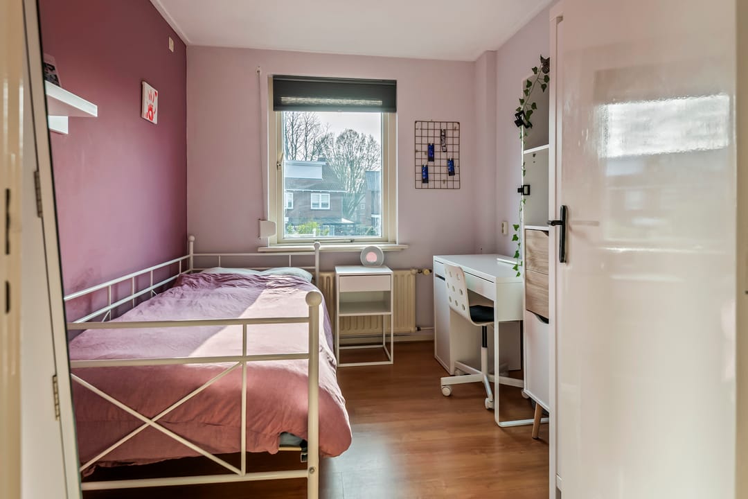 Spacious semi-detached home with character, featuring 5 bedrooms, suite-style living room, and sunny southwest garden — 34