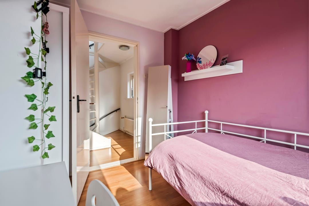 Spacious semi-detached home with character, featuring 5 bedrooms, suite-style living room, and sunny southwest garden — 35