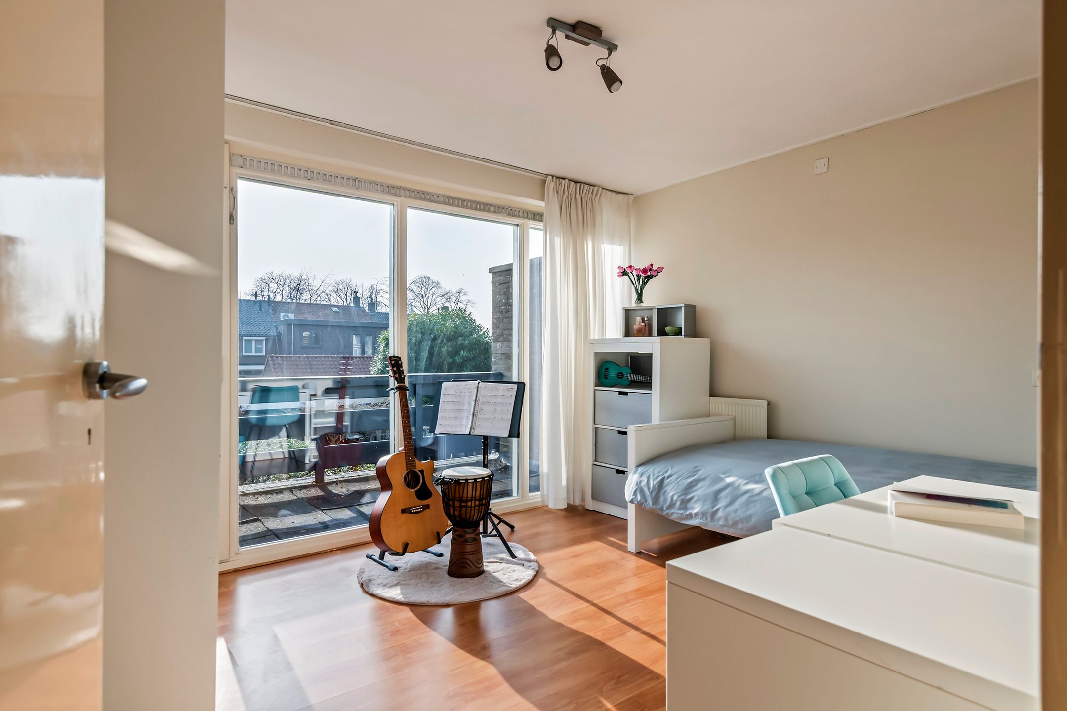 Spacious semi-detached home with character, featuring 5 bedrooms, suite-style living room, and sunny southwest garden — 36