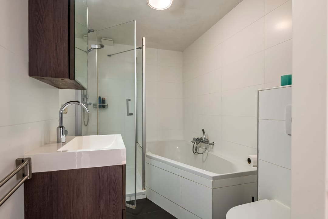 Spacious semi-detached home with character, featuring 5 bedrooms, suite-style living room, and sunny southwest garden — 38