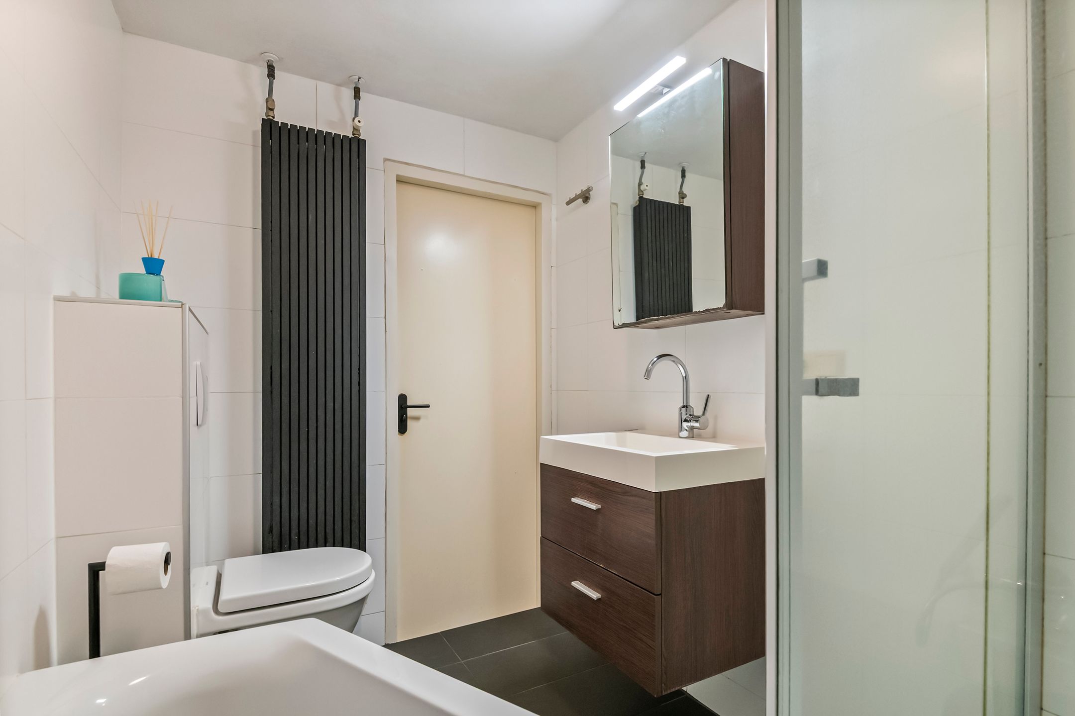 Spacious semi-detached home with character, featuring 5 bedrooms, suite-style living room, and sunny southwest garden — 39