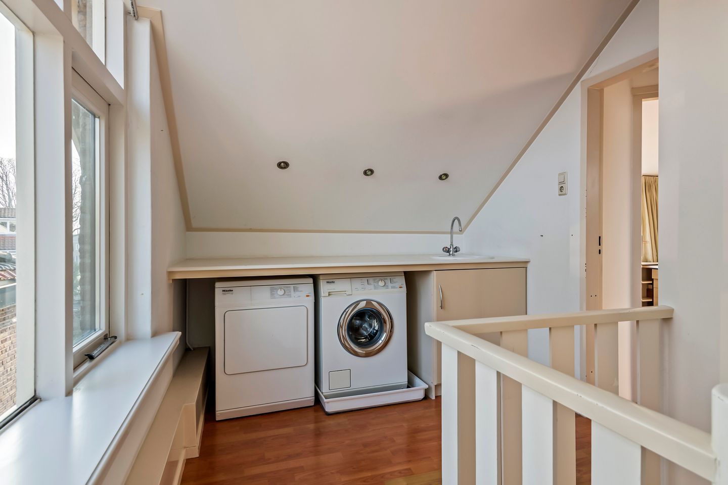 Spacious semi-detached home with character, featuring 5 bedrooms, suite-style living room, and sunny southwest garden — 41
