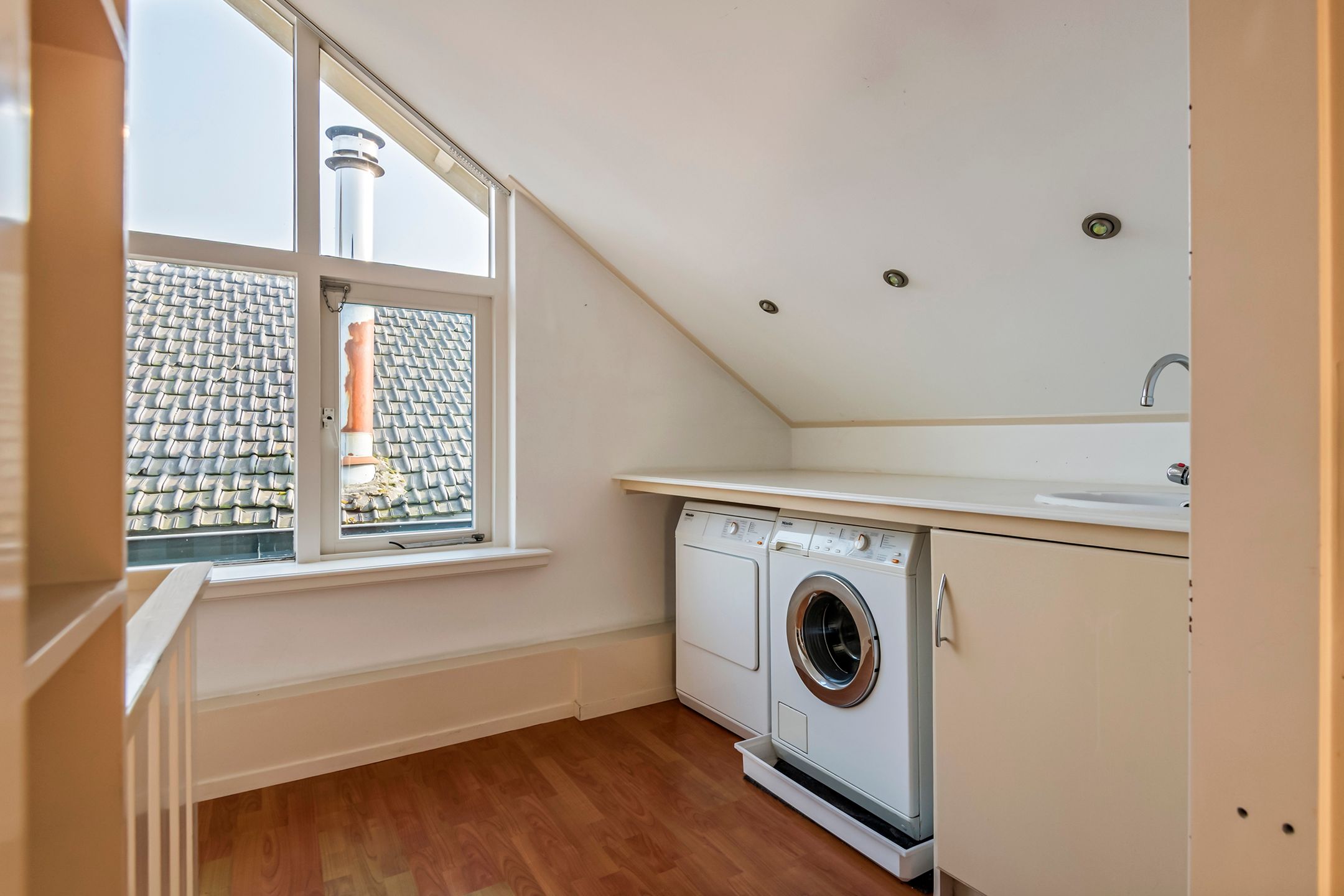 Spacious semi-detached home with character, featuring 5 bedrooms, suite-style living room, and sunny southwest garden — 42