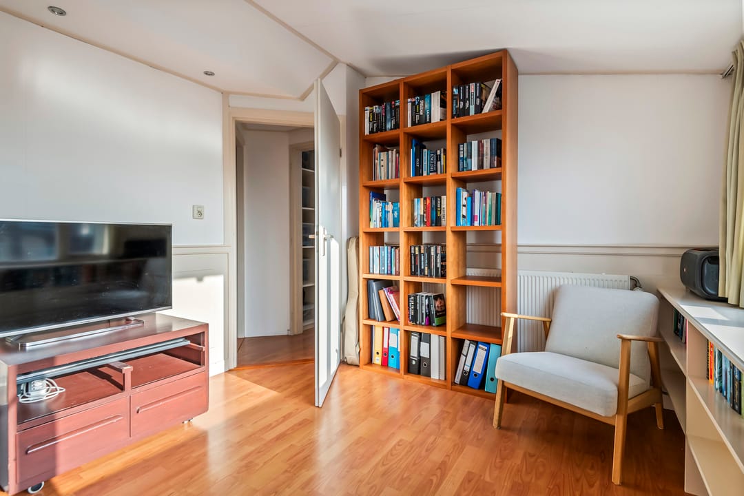 Spacious semi-detached home with character, featuring 5 bedrooms, suite-style living room, and sunny southwest garden — 44