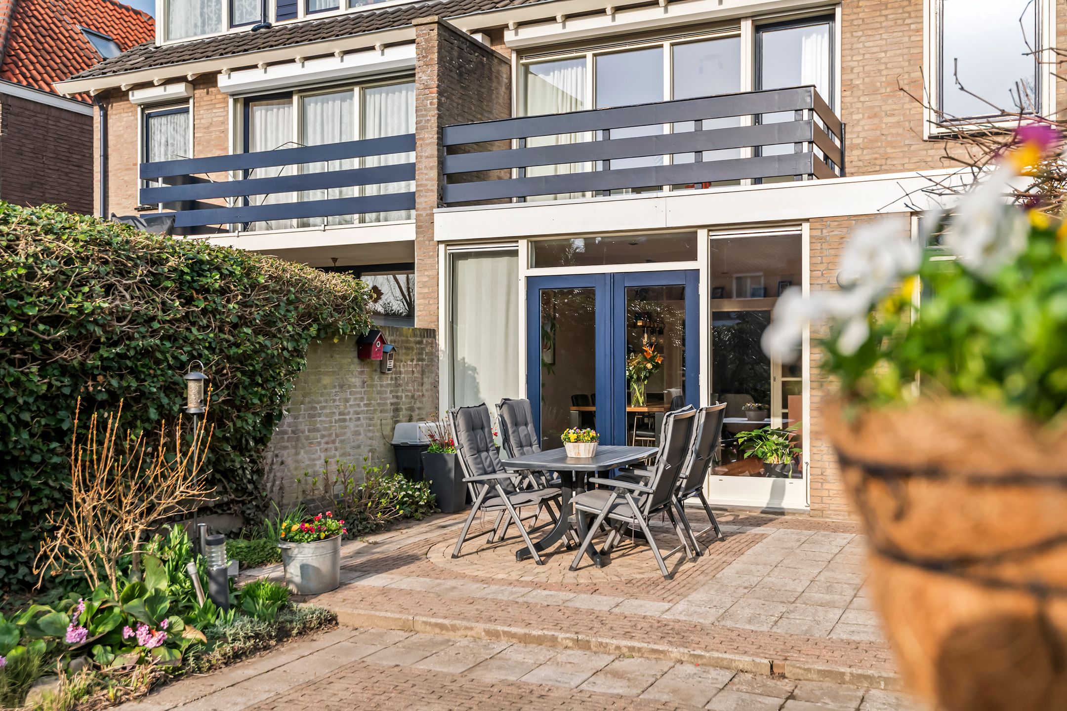 Spacious semi-detached home with character, featuring 5 bedrooms, suite-style living room, and sunny southwest garden — 51