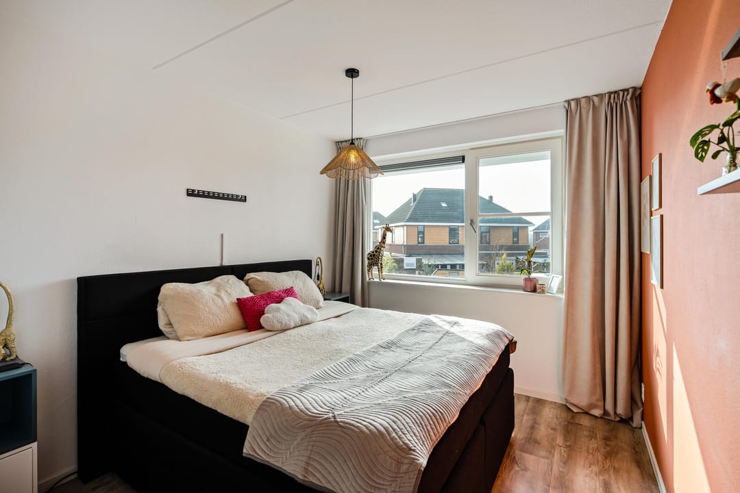 Modern corner home with four bedrooms and spacious driveway — 16