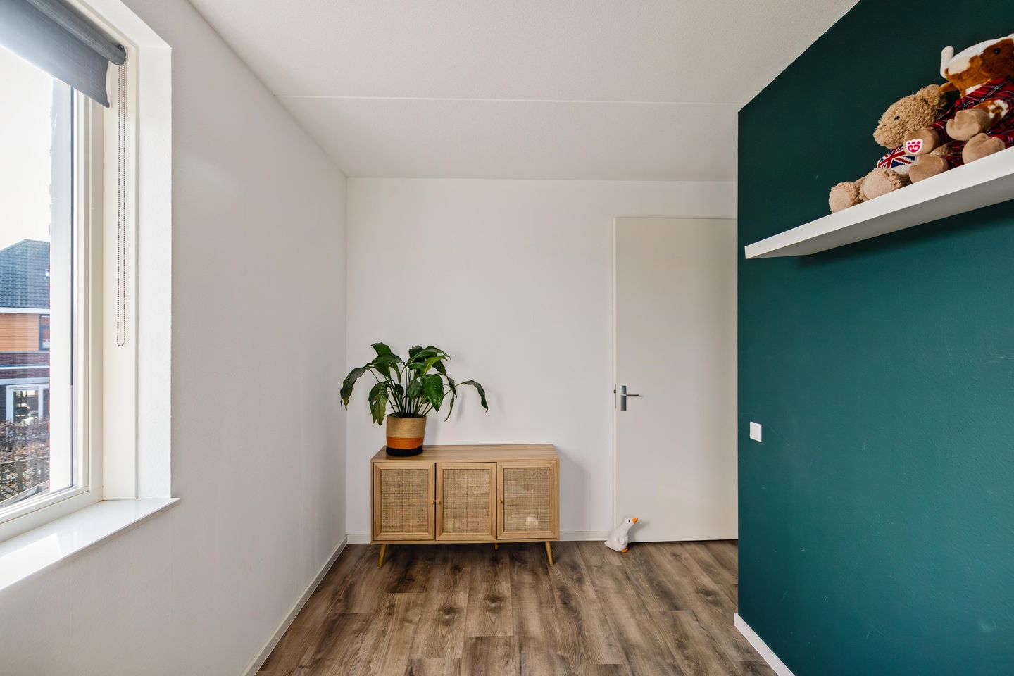 Modern corner home with four bedrooms and spacious driveway — 20