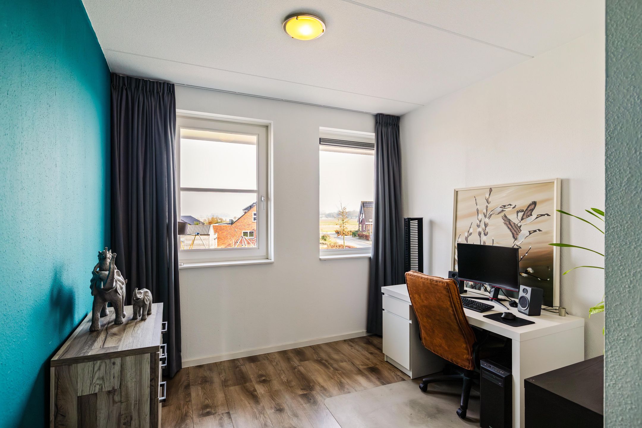 Modern corner home with four bedrooms and spacious driveway — 21