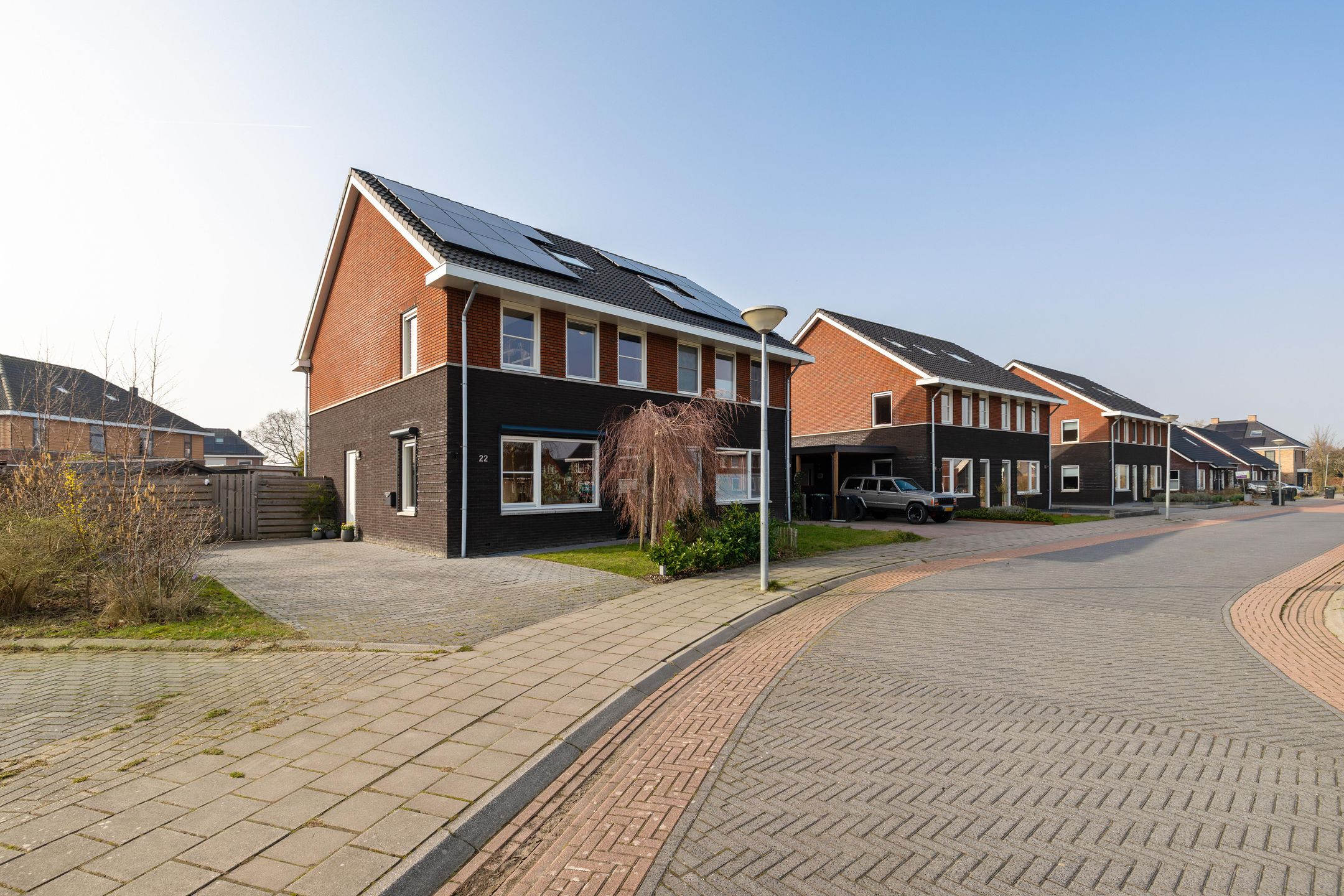 Modern corner home with four bedrooms and spacious driveway — 33
