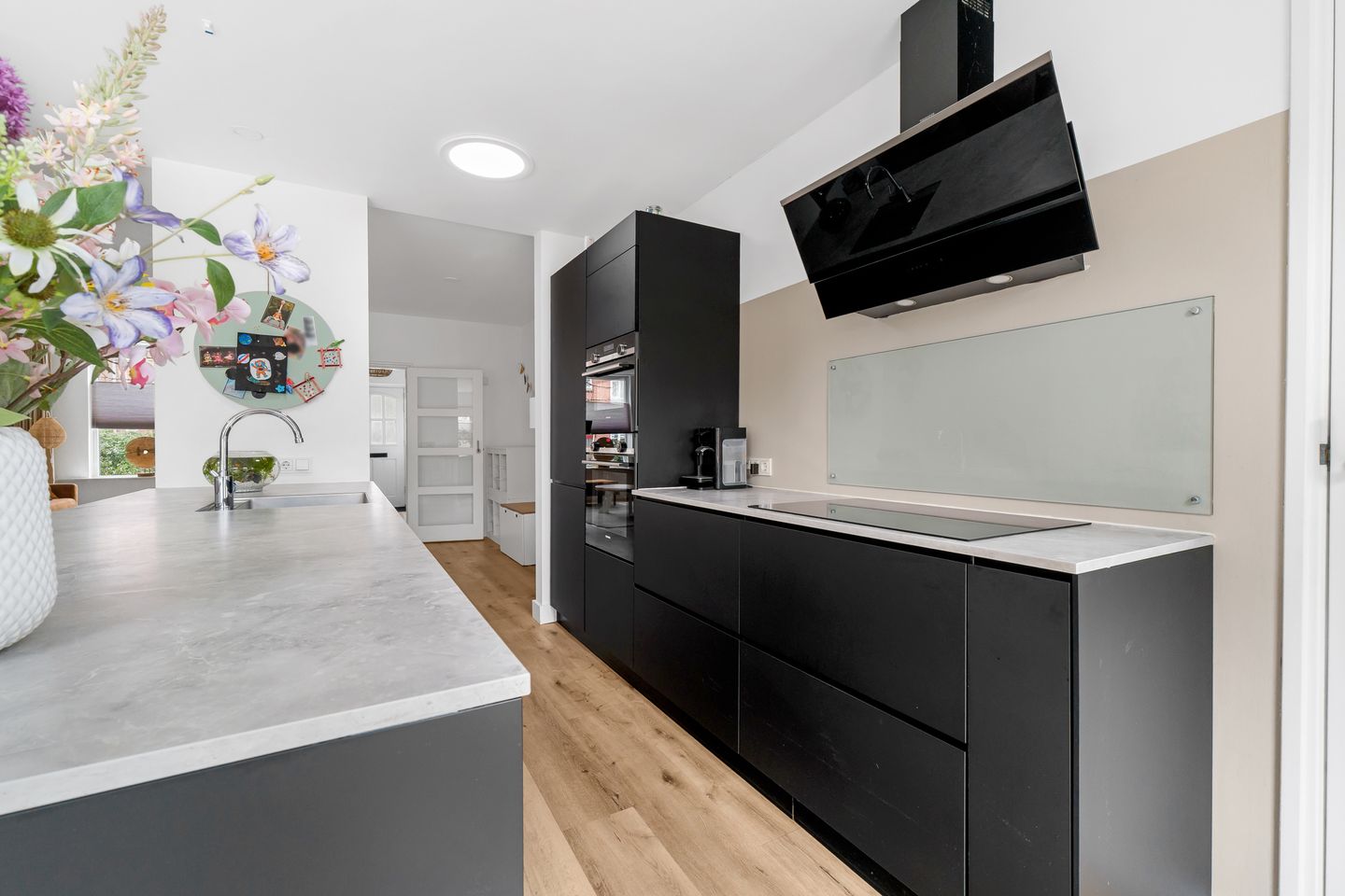 Extended corner house with modern kitchen and four bedrooms — 10