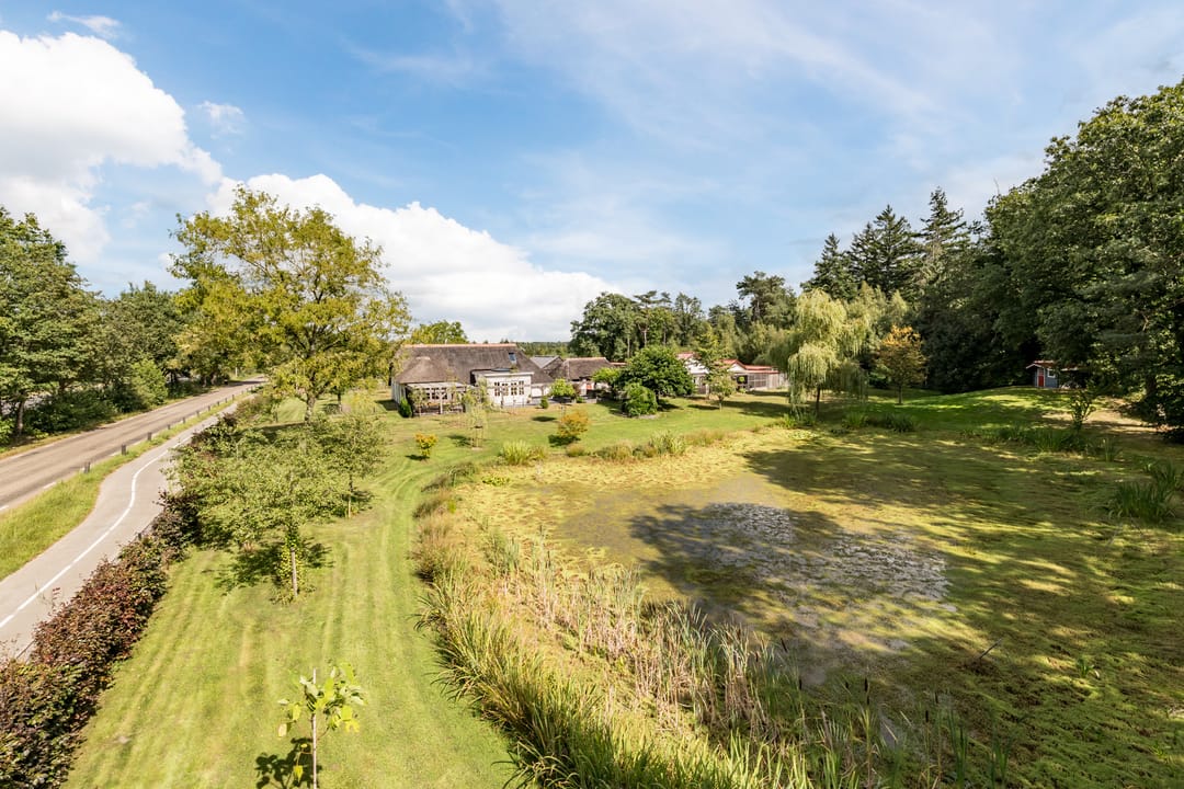 Unique Farmhouse with Versatile Outbuildings and Natural Surroundings — 54