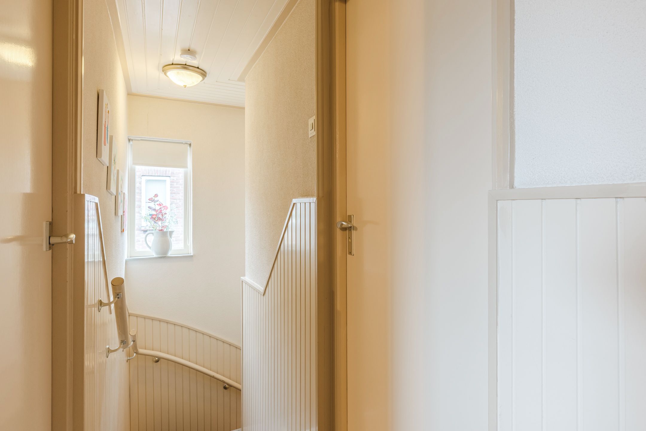 Semi-detached house with deep south-facing backyard, garage and carport in Gilze village center — 21
