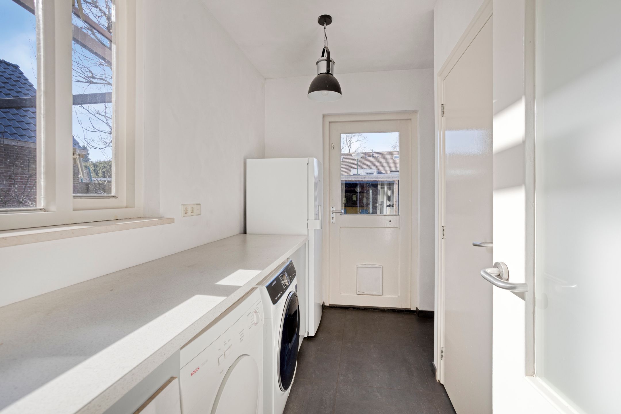 Modern detached home with generous living space and exceptional parking facilities — 12