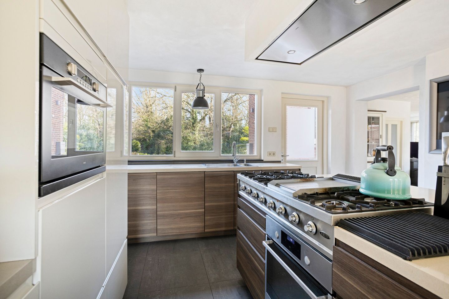 Modern detached home with generous living space and exceptional parking facilities — 10