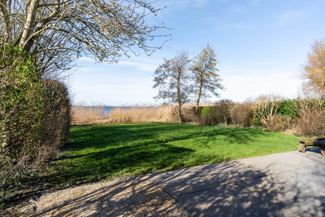 Waterfront Living with Panoramic Lake Views in Friesland — 36