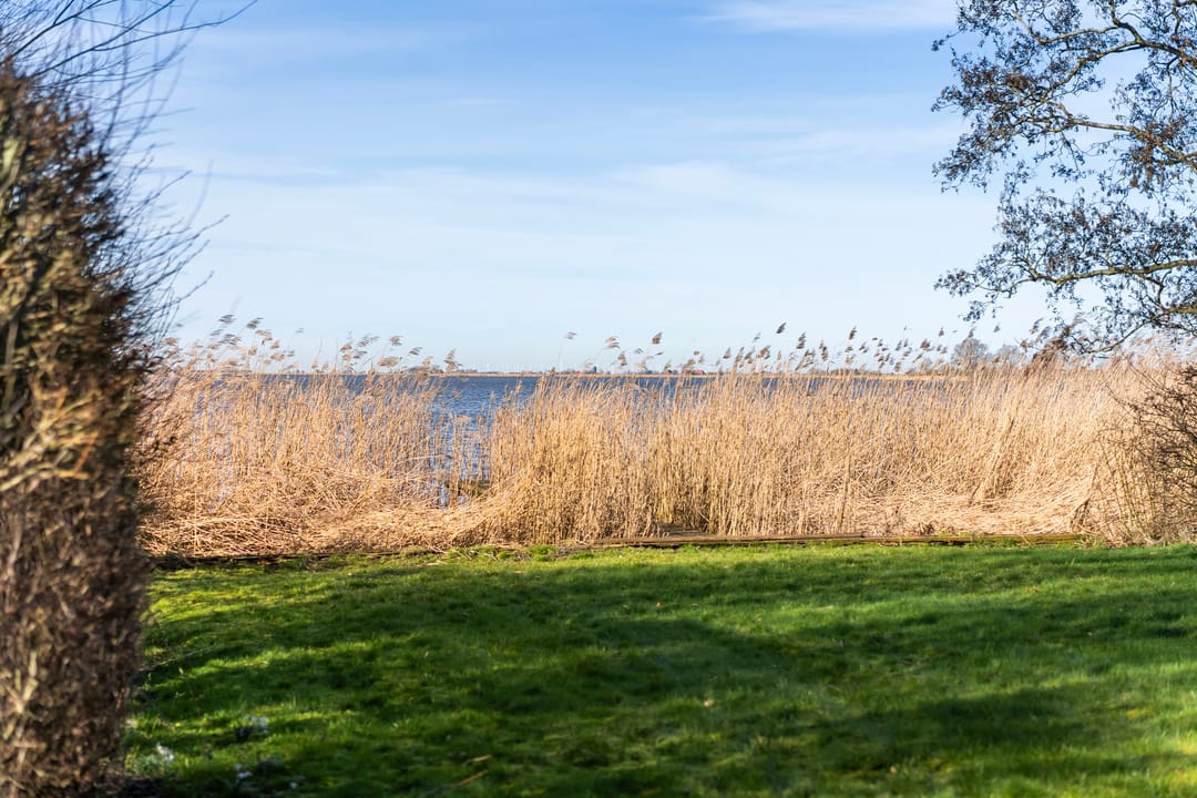 Waterfront Living with Panoramic Lake Views in Friesland — 40