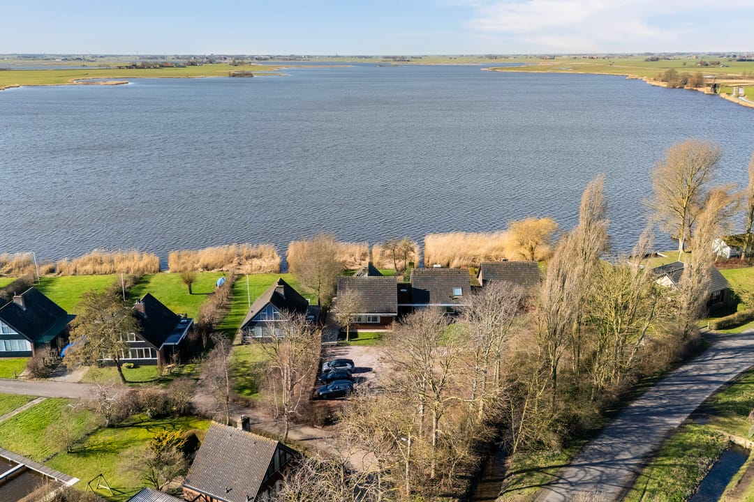 Waterfront Living with Panoramic Lake Views in Friesland — 55