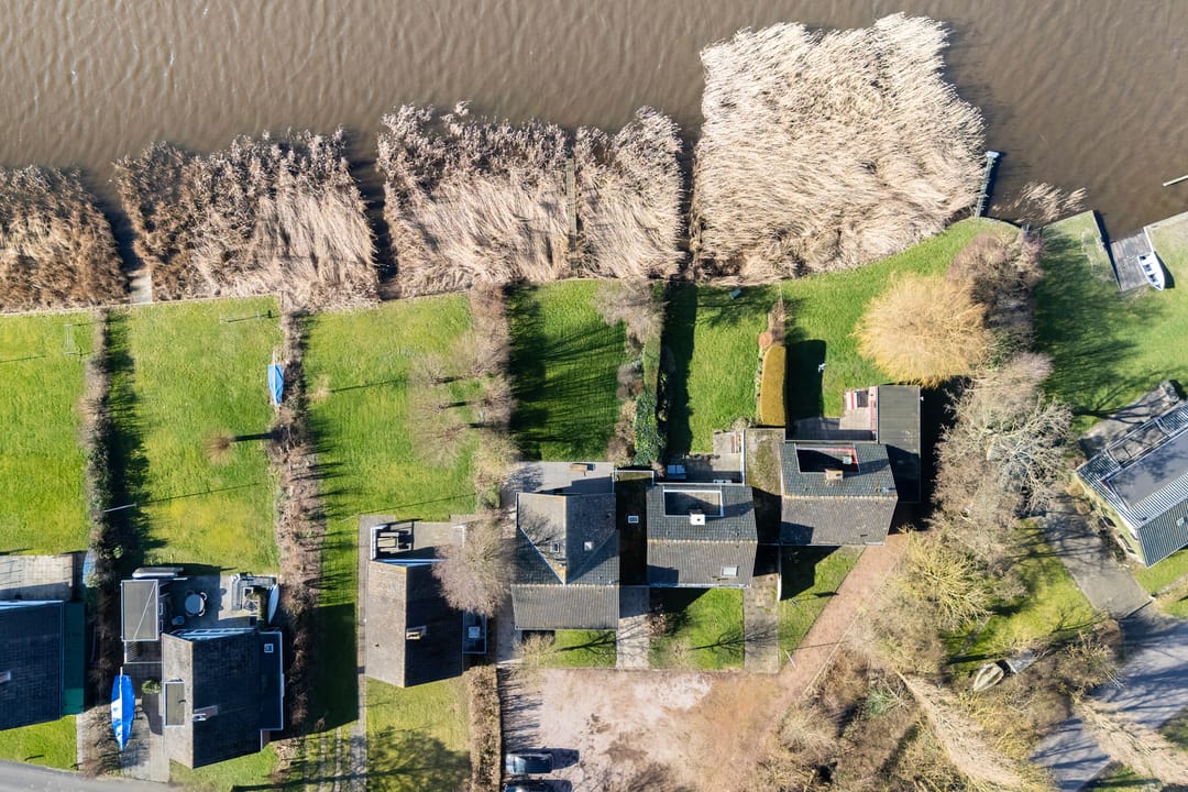 Waterfront Living with Panoramic Lake Views in Friesland — 57