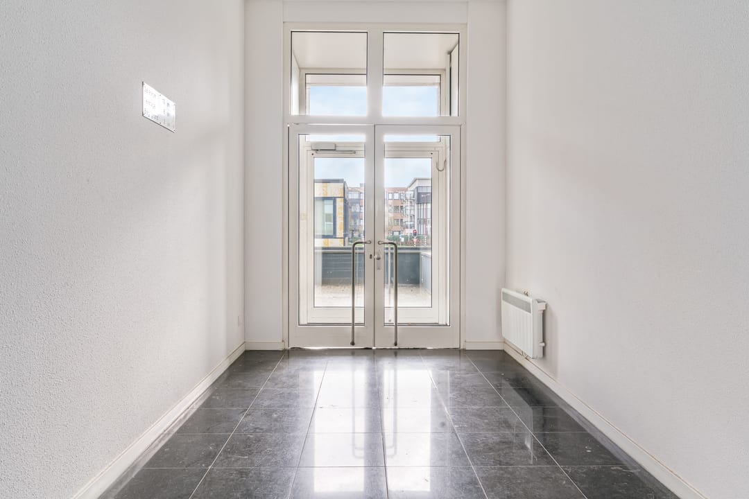 Bright Corner Apartment with South-Facing Balcony Near City Center — 23