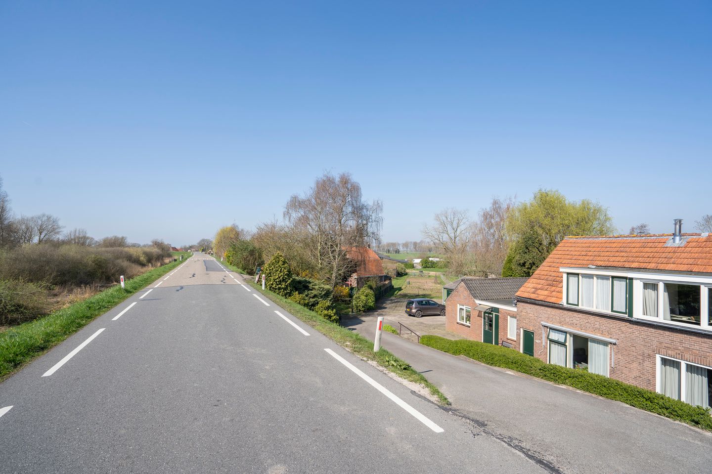 Characteristic semi-detached home with spacious garden and open dike views — 25
