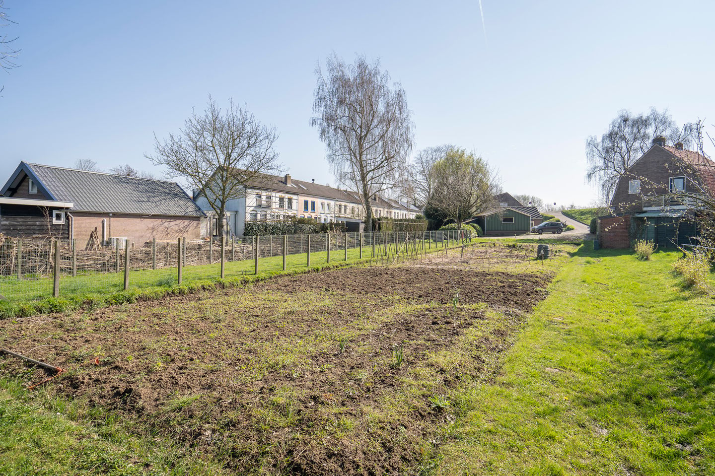 Characteristic semi-detached home with spacious garden and open dike views — 29