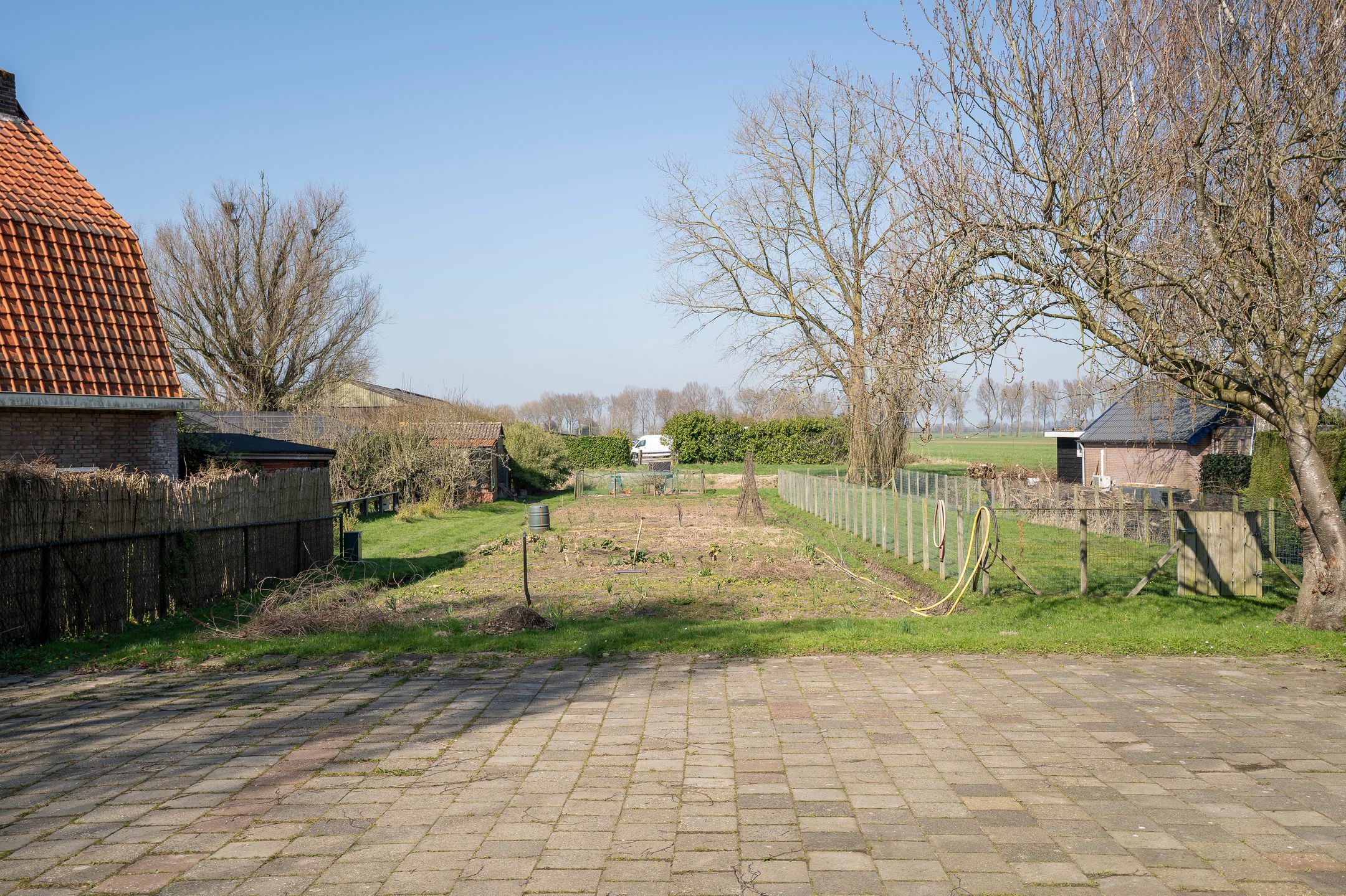 Characteristic semi-detached home with spacious garden and open dike views — 30