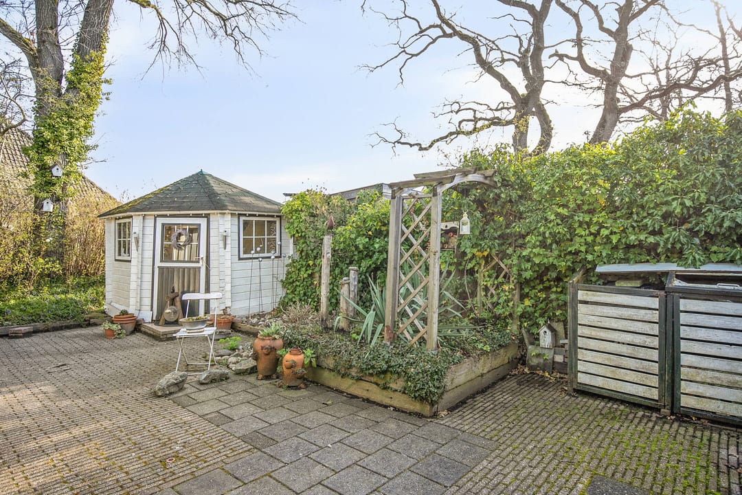 Charming 1970s Starter Home with Playful Z-Shaped Living Room — 32