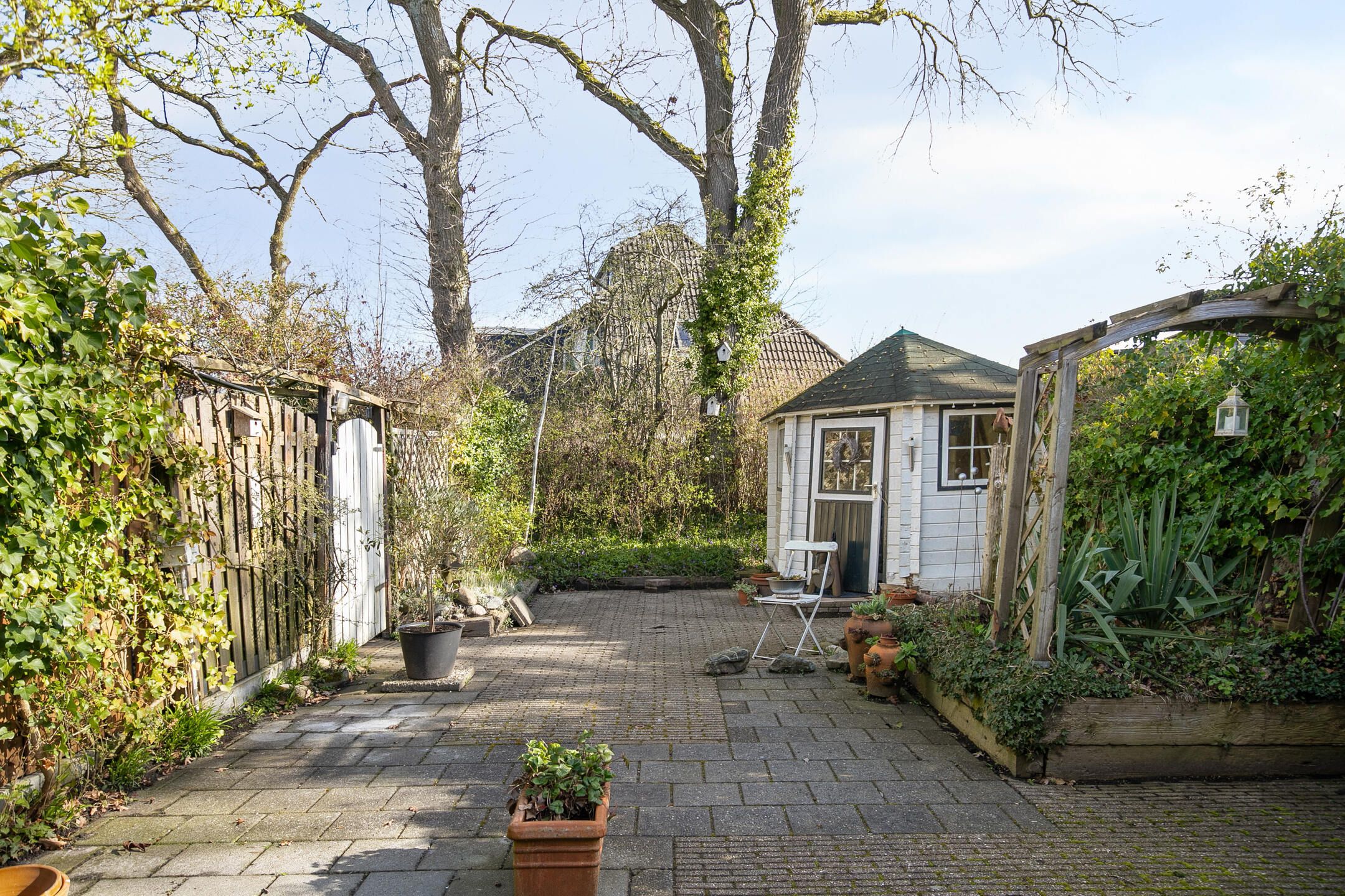 Charming 1970s Starter Home with Playful Z-Shaped Living Room — 33