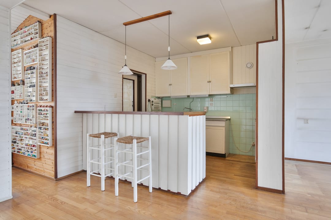 Charming 1970s Starter Home with Playful Z-Shaped Living Room — 16