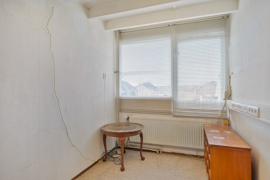Charming 1970s Starter Home with Playful Z-Shaped Living Room — 28