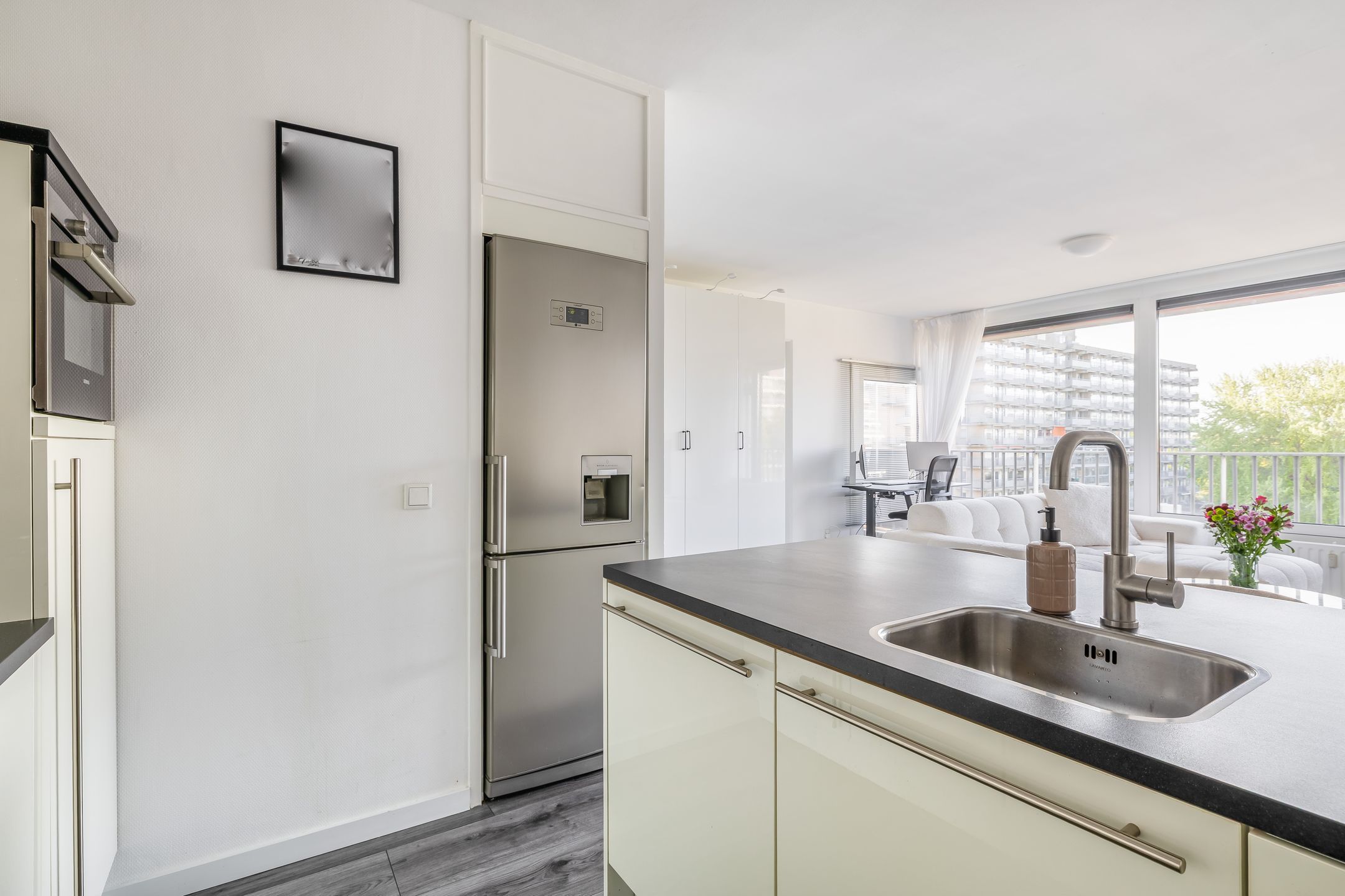 Move-in ready starter apartment with sunny south-facing balcony and private storage — 18