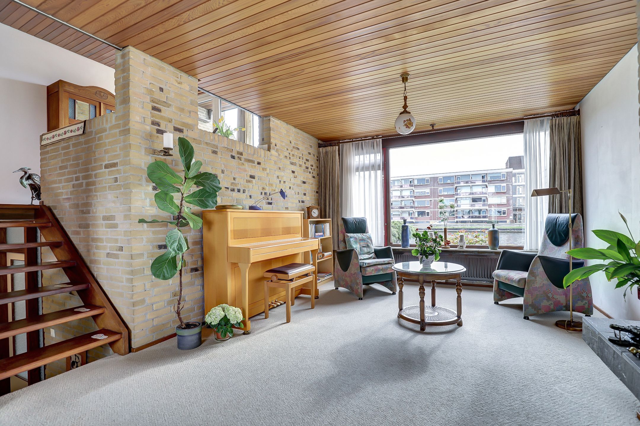 Spacious split-level home with river views, character and versatile living options — 15