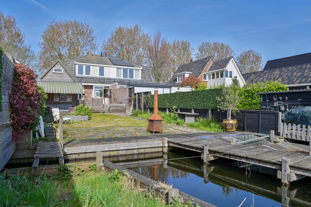 Characteristic 1930s Semi-Detached Home with Private Water Access and Boat Dock — 26