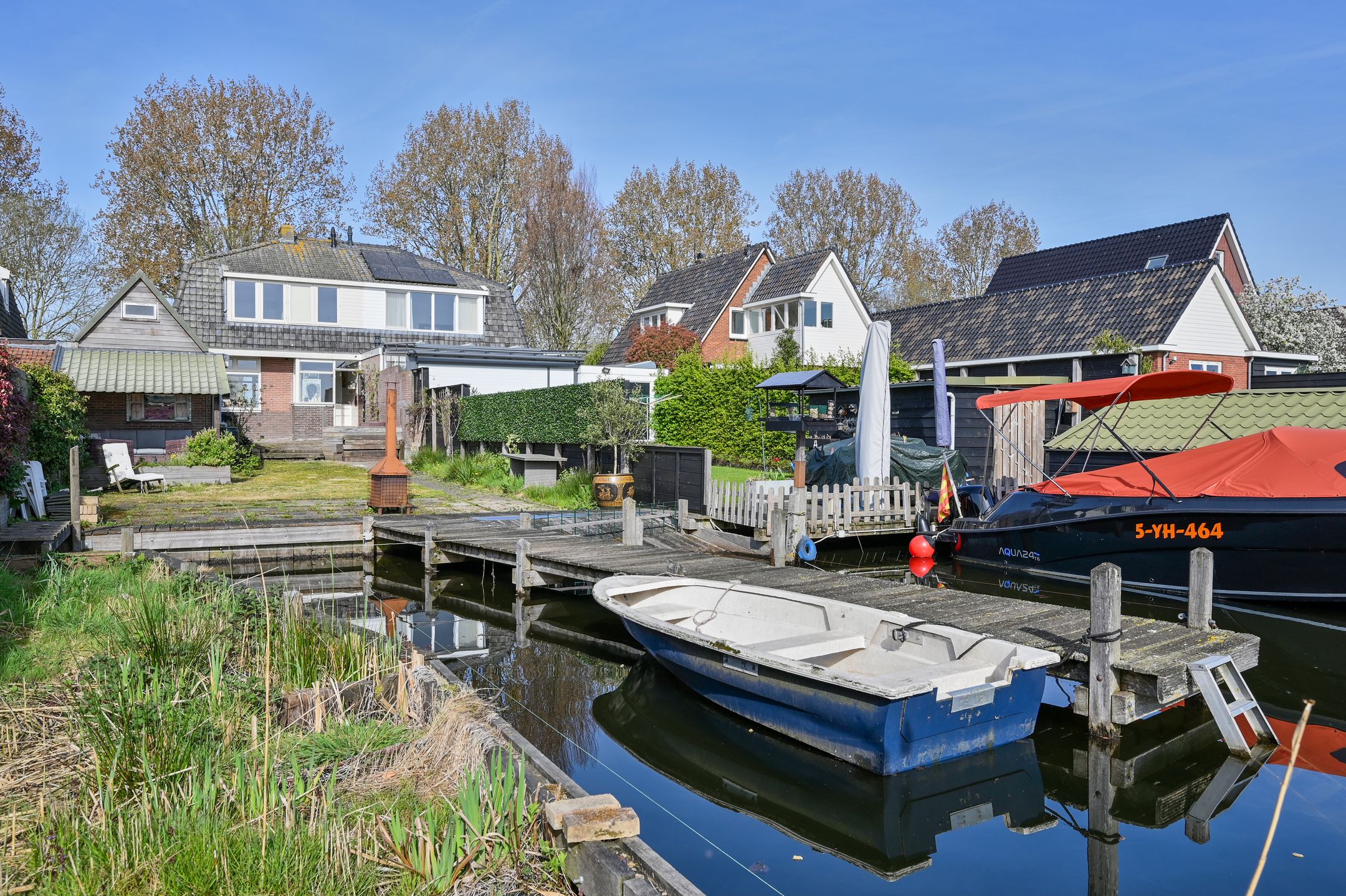 Characteristic 1930s Semi-Detached Home with Private Water Access and Boat Dock — 27