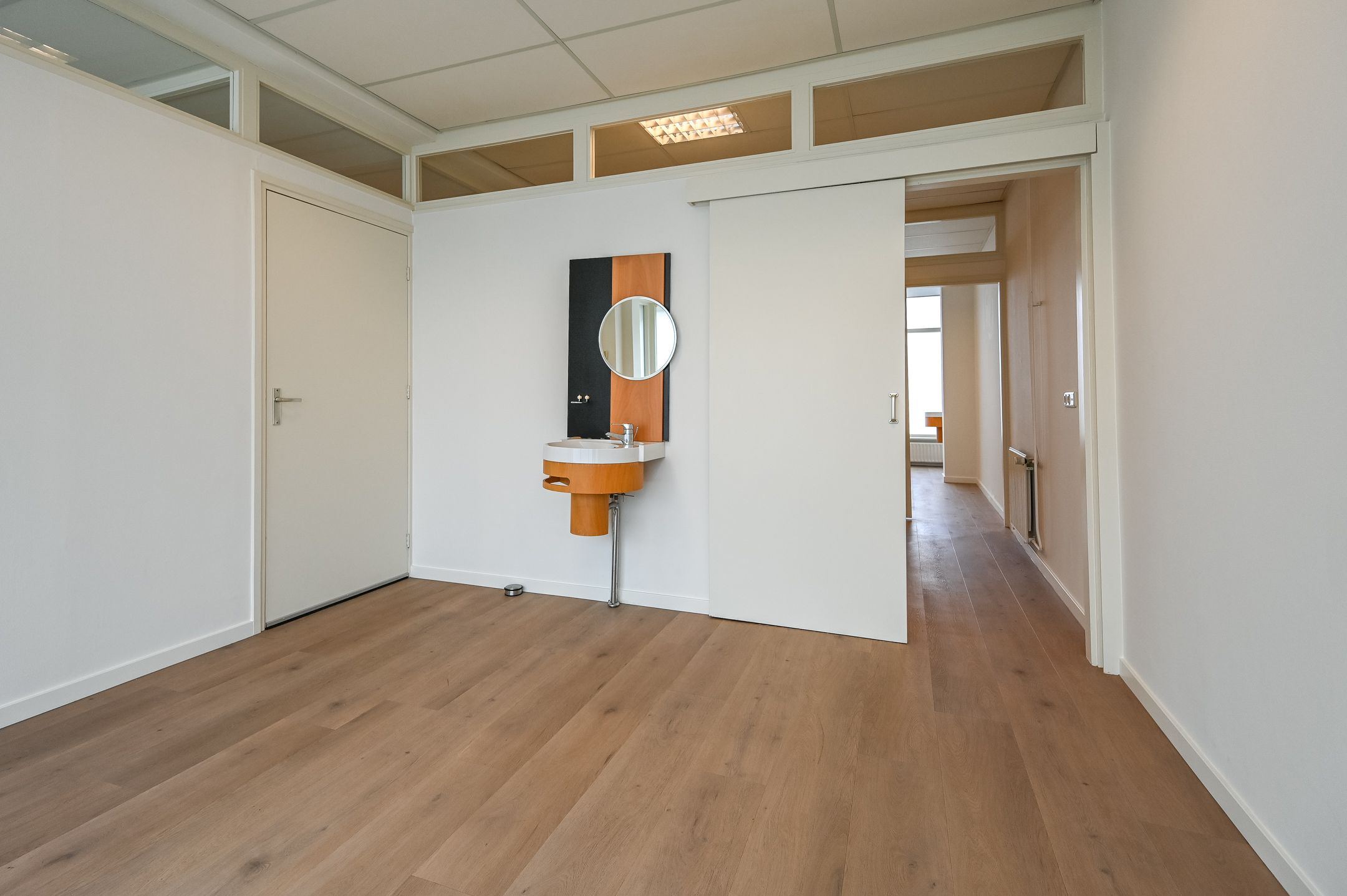 Versatile Mixed-Use Property with Commercial Space and Upper Apartment on Lively Kennemerlaan — 24
