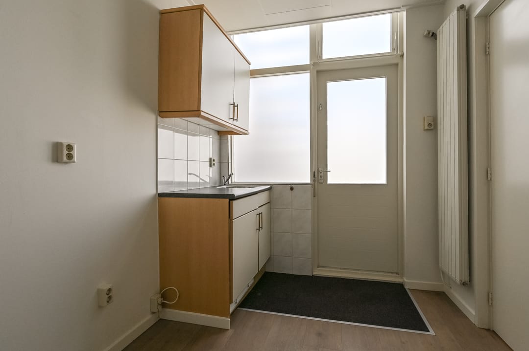 Versatile Mixed-Use Property with Commercial Space and Upper Apartment on Lively Kennemerlaan — 32