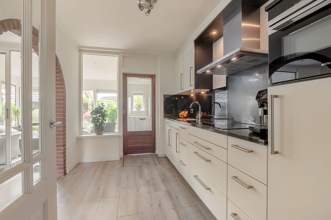 Spacious extended semi-detached family home with garage and deep garden in Lobith — 13